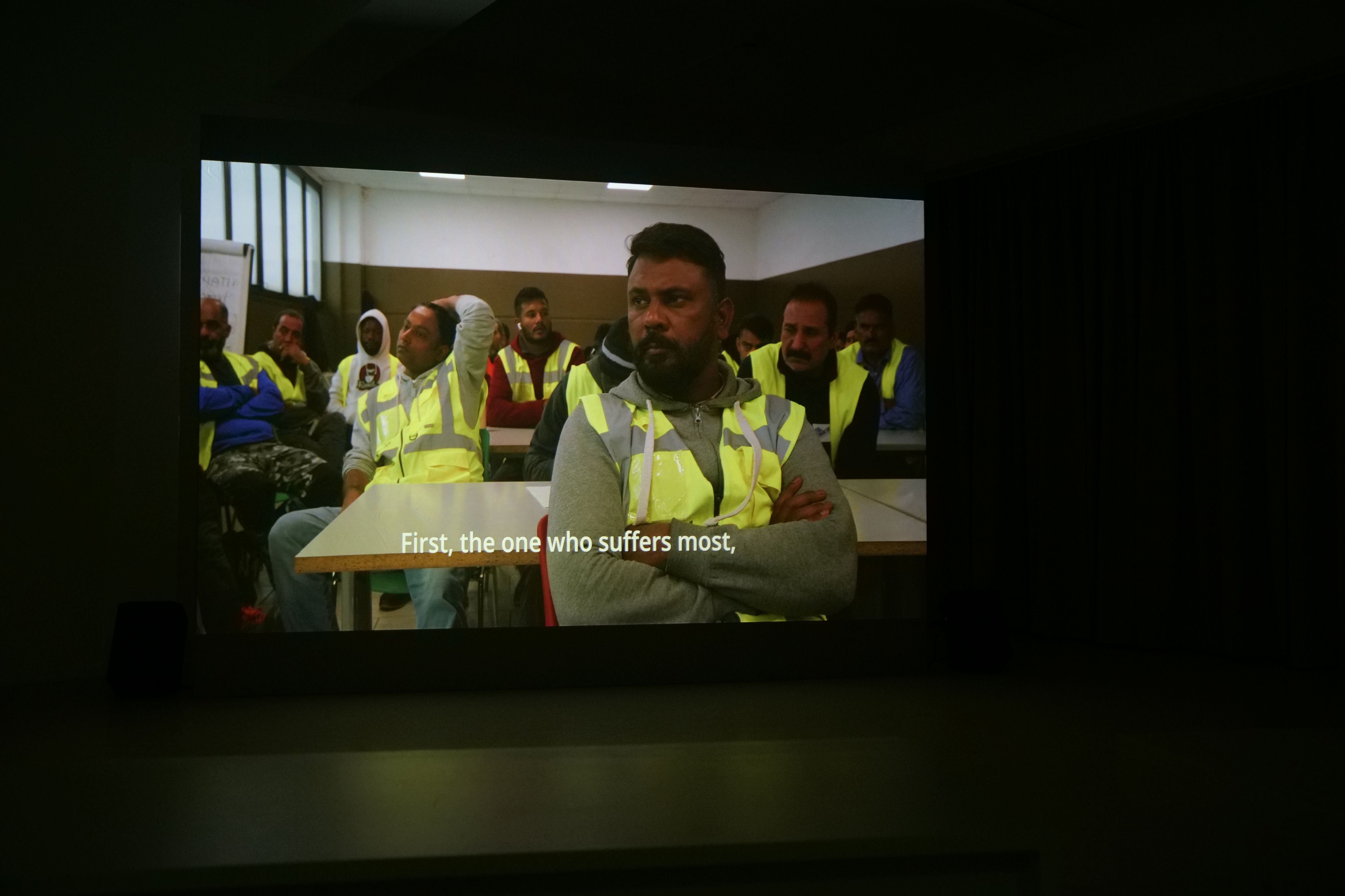 Photo: Dockworkers in Italy. Still from a film shown at Hägerstens medborgarhus